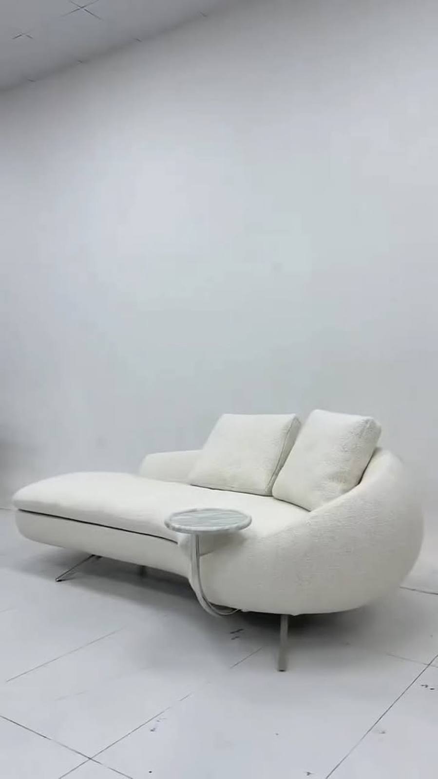 This shellshaped chaise sectional is your centerpiece.