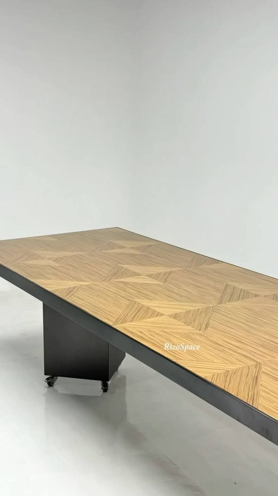 A long rectangular dining table sits center frame