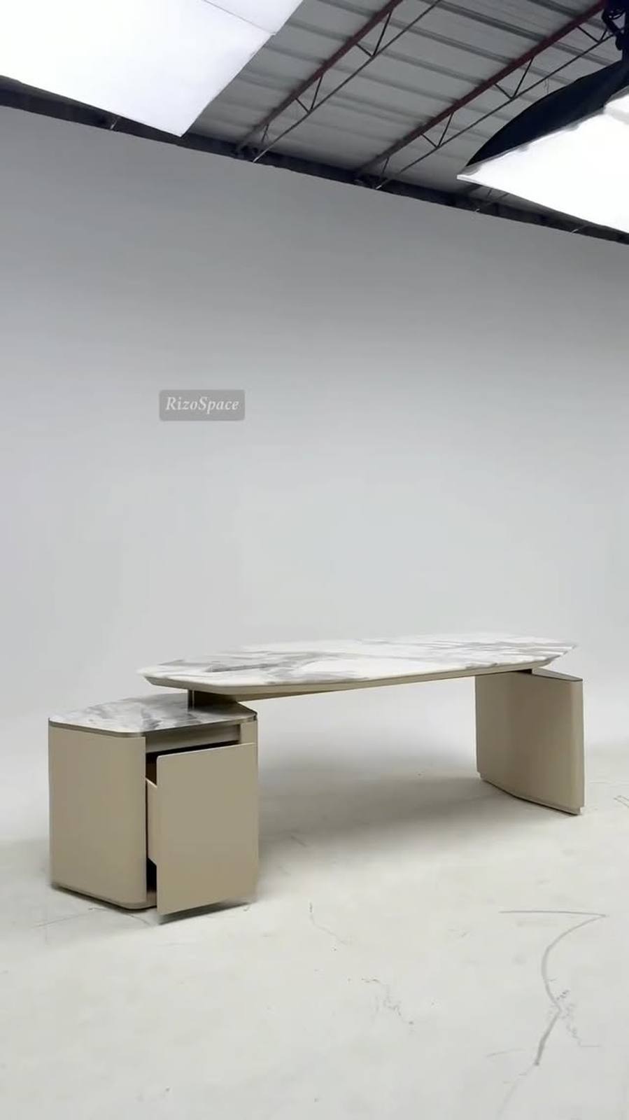 It opens in a large industrial workshop where