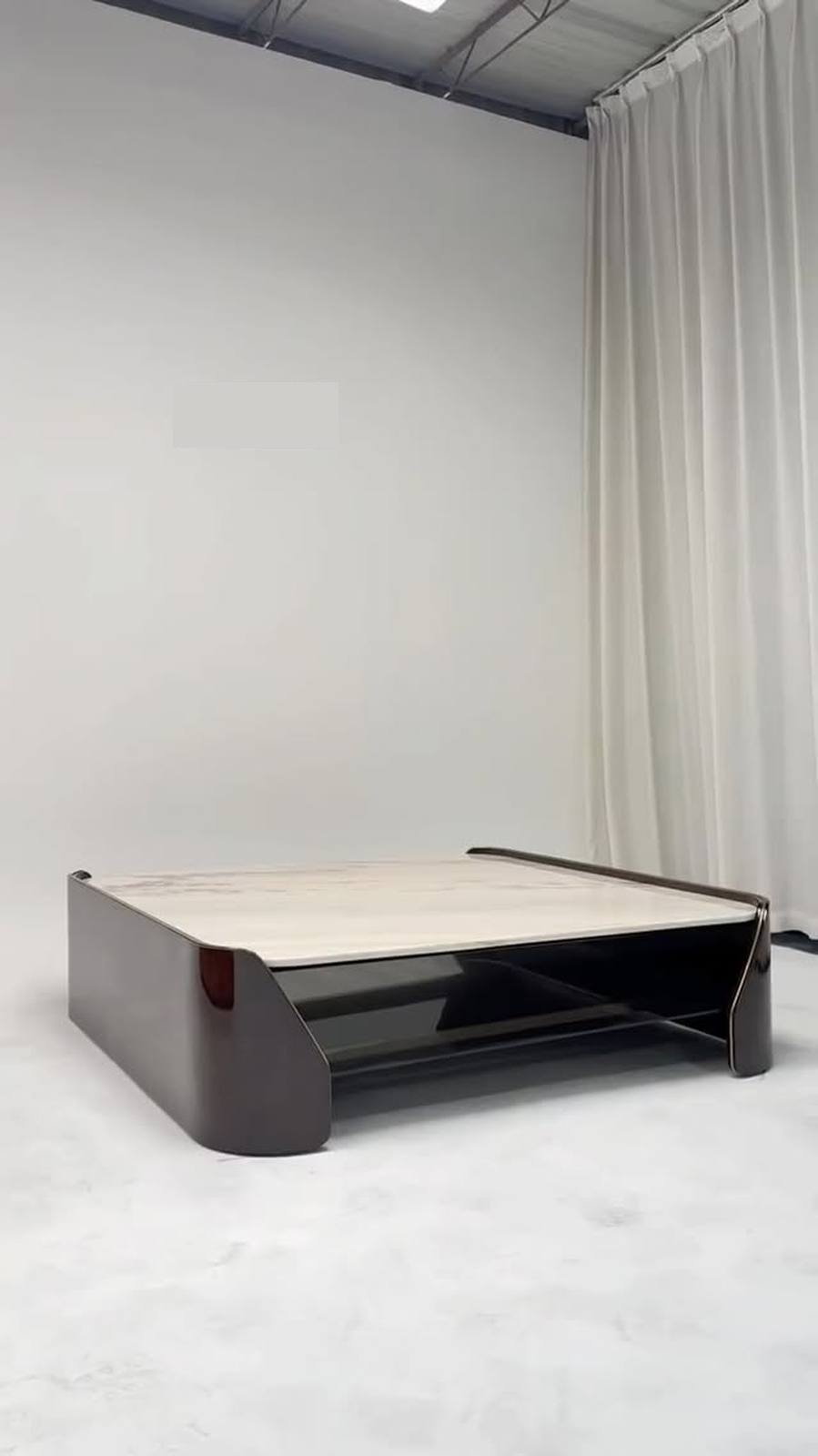 Curved forms and mixed materials turn furniture into