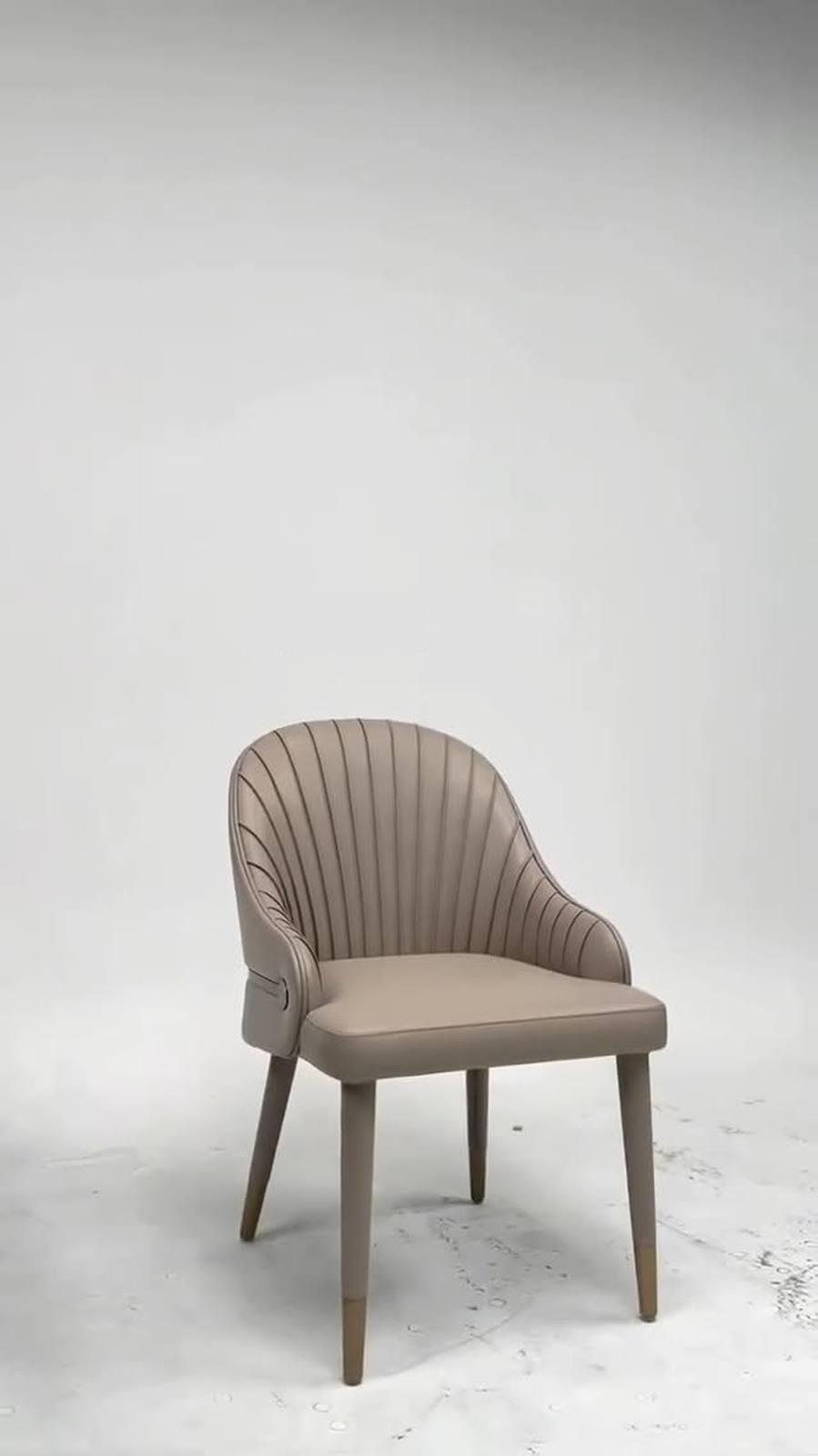 Artful pleats define this dining chair.