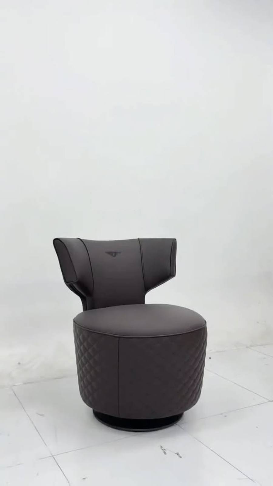 Curved shell accent chair with sculptural rounded