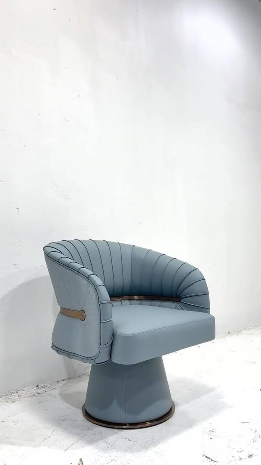 A sculptural swivel armchair